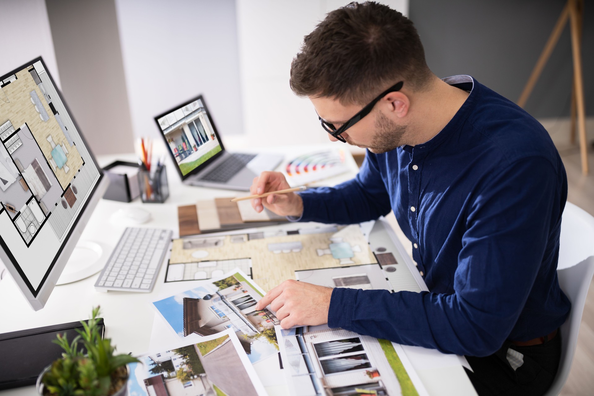 Real Estate Designer Working On Computer